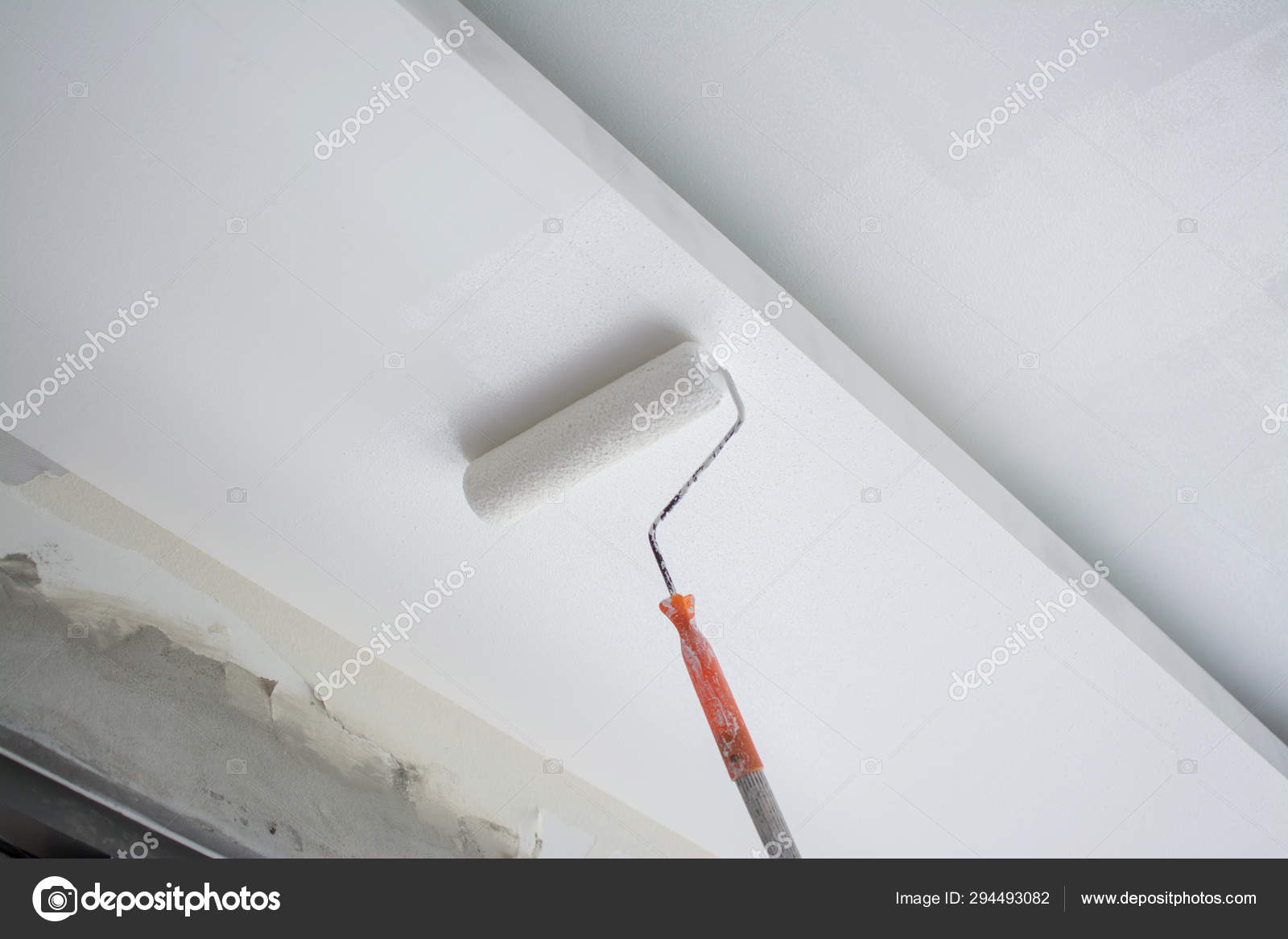 Painting A White Gypsum Plaster Ceiling With Paint Roller