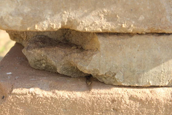 Vintage, cracked stone tiles stacked close-up