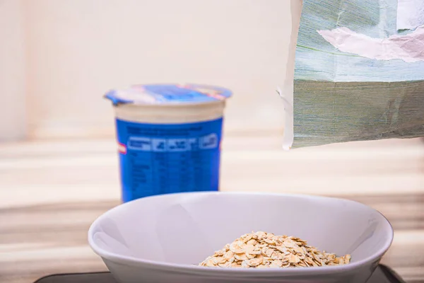 Preparing Cereals Next Yogurt Box Wooden Table — Stock Photo, Image