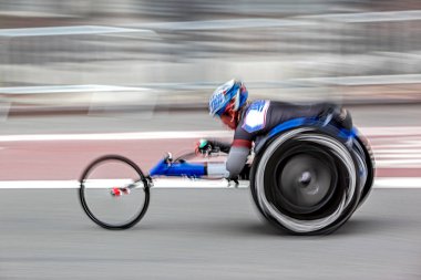 competition sports wheelchair racing in motion blur clipart