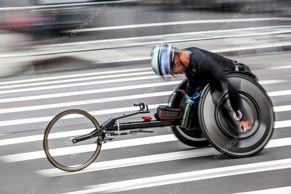 competition sports wheelchair racing in motion blur