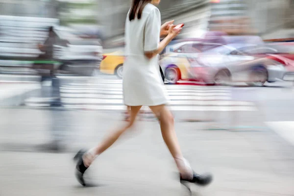 abstract image of business people in the street and modern style with a blurred background