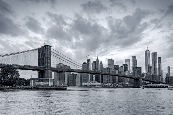 Panoramic view new york city downtown manhattan skyline at evening with skyscrapers and brooklyn bridge