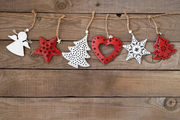 Rustic Christmas decorative, Xmas ornament hanging  on wood wall background. vintage style.