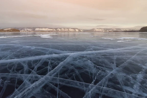 Baikal in the winter. Ice expanses at sunset. Russia, Siberia