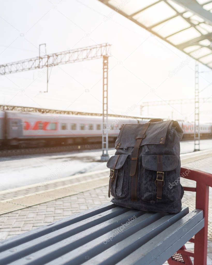 Backpack at the railway station. Travel concept.
