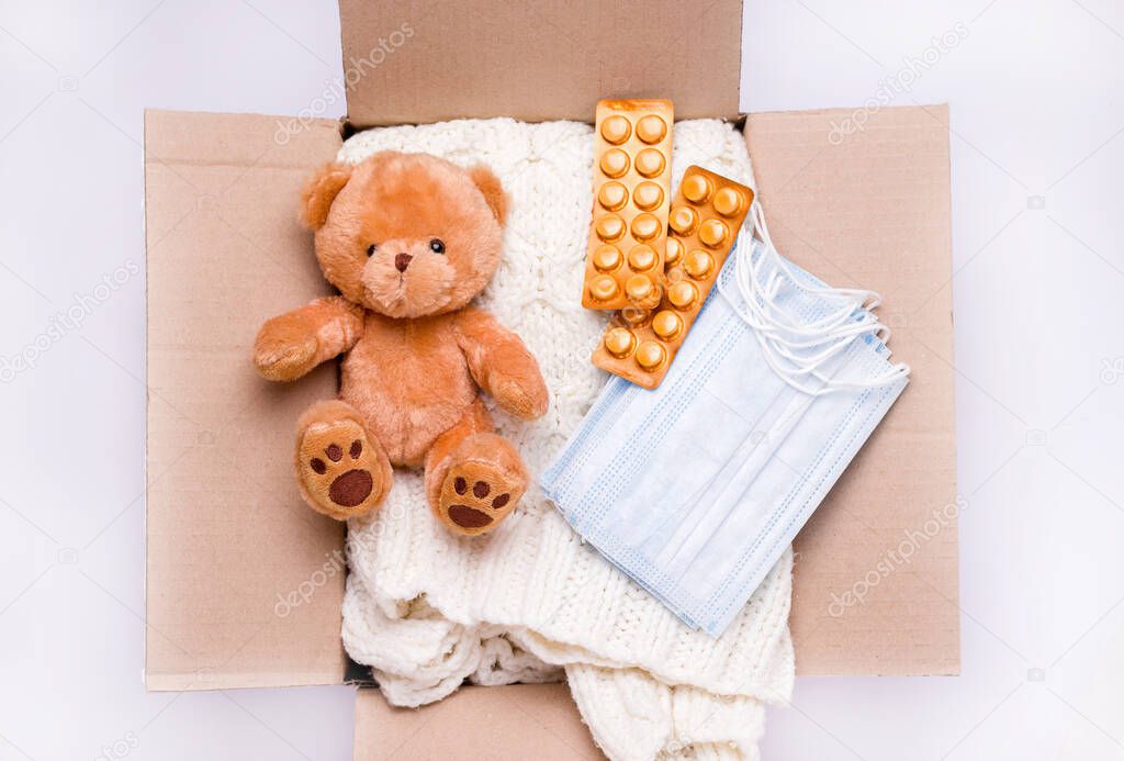 Donation concept. A package of care in which toys, medicines, items and personal protective equipment