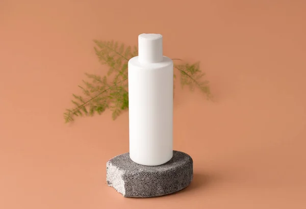 Cosmética Burlona Botella Blanca Sobre Piedra Gris —  Fotos de Stock