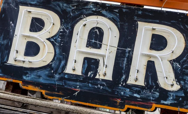 Grungy rusty old painted bar sign — Stock Photo, Image