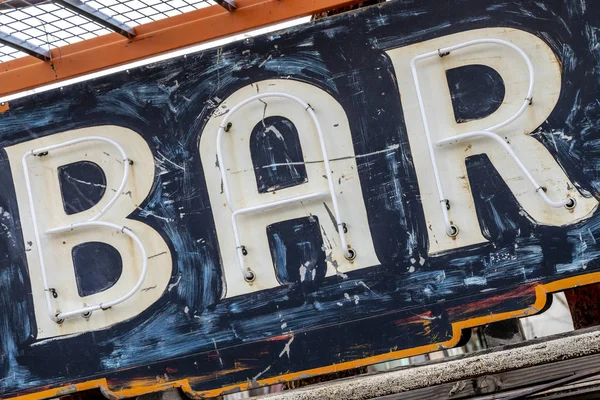 Grungy rusty old painted bar sign — Stock Photo, Image