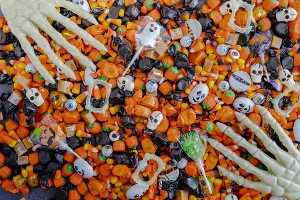 Halloween candy spilled out on table — Stock Photo, Image