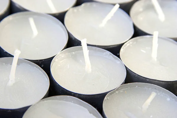 photo of white candles on a solid background
