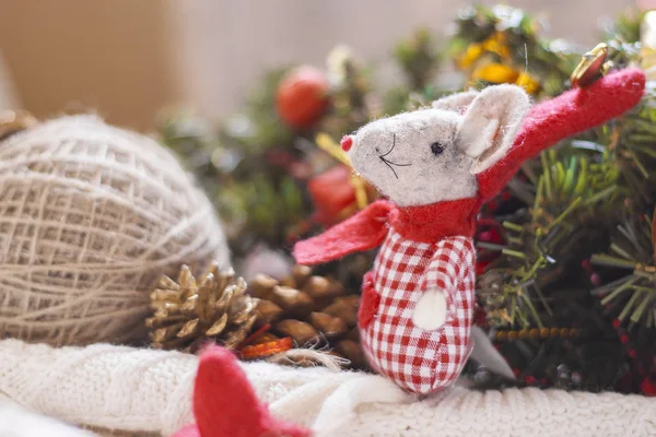 Merry Christmas card with toy mouse in red hat