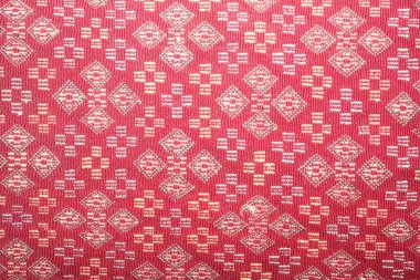  100 yıldan daha eski renkli Tayland el sanatları Peru tarzı halı yüzeyi. Doğal malzemelerden yapılmış eski, yırtık, kimyasal malzemelerden yapılmış. Yakın çekim..