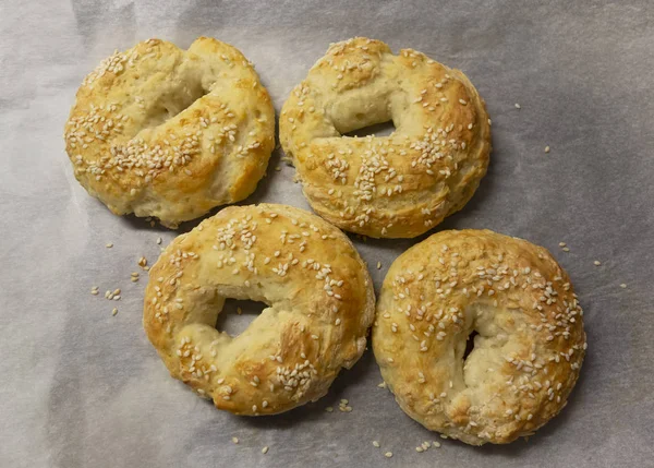 Four Homemade Sesame Seed Bagels Parchment Paper — Stock Photo, Image