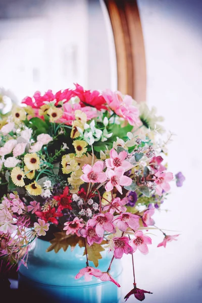 Colorful flowers in a vintage jar ,Vintage retro style.