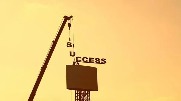 Workers and cranes are installing billboards.