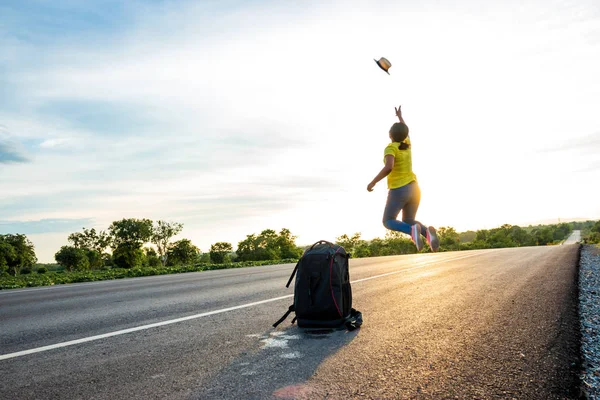 Happy woman jump At the time of the sun set Concept of vacation and travel