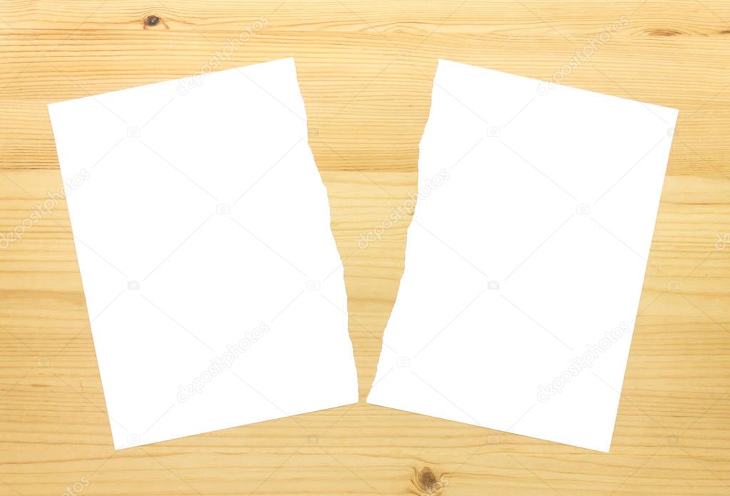 White Ripped Paper in Half on Wood Background. White torn paper 2 part for separate or partition or divide concept