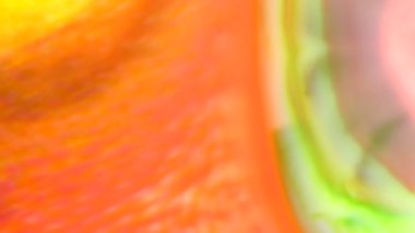 Hareketli kırmızı yeşil akışı soyut gıda renk mürekkep veya akan arka plan. Renkli gıda renk sanatsal kavram arka plan için süt yüzeyindeki mürekkep eriterek soyut. 4 k 3840 x 2160 yüksek çözünürlüklü görüntüleri