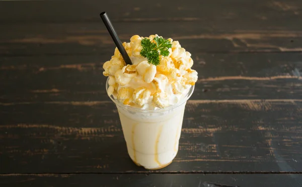 Sweet Caramel Popcorn and Whipped Cream and Fresh Milk with Parsley