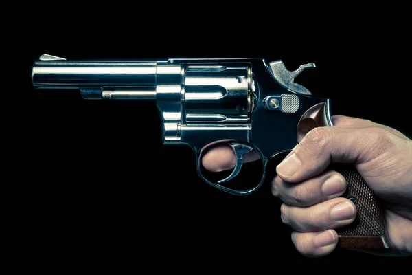 Vintage roestvrij pistool of shooter in menselijke hand side View — Stockfoto