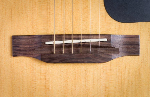 Wood Bridge and Saddle of Acoustic Guitar
