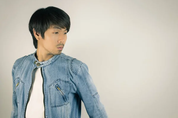 Young Asian Man in Jeans or Denim Jacket on Left Frame in Vintag