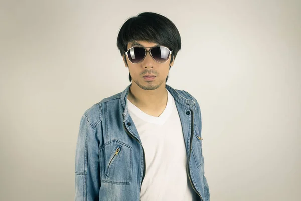 Young Asian Man in Jeans or Denim Jacket Wear Sunglasses in Fron