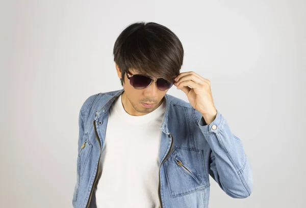 Young Asian Man in Jeans or Denim Jacket Wear Sunglasses Looking — Stock Photo, Image