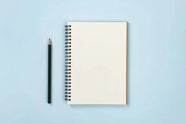 Spiral Notebook or Spring Notebook in Unlined Type and Pencil on Blue Pastel Minimalist Background