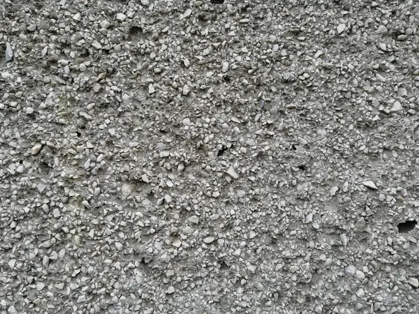 Concrete wall with marble chips — Stock Photo, Image