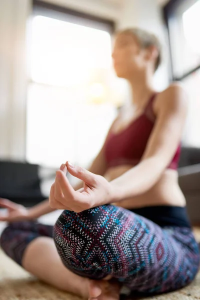 Trendy woman doing yoga as part of her mindfulness morning routine — Stock Photo, Image