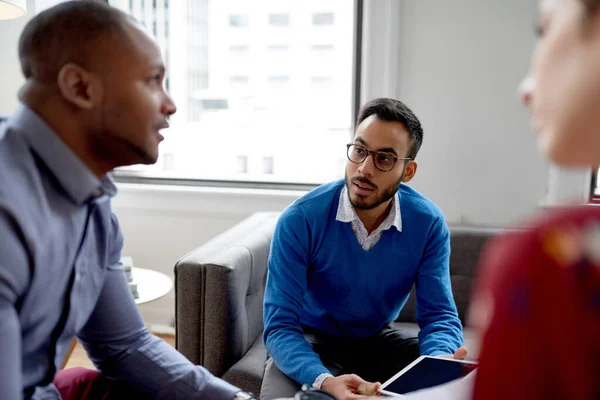 Multi-ethnic team of creative millenials collaborating on a brainstorm project — Stock Photo, Image