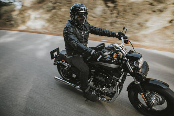 MALAGA, SPAIN - July 15, 2018: Man riding his Harley Davidson mo