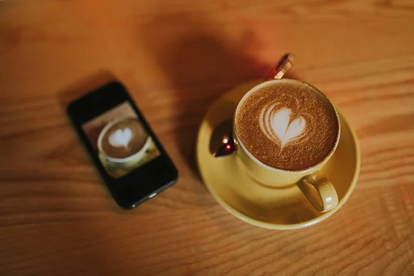 Cup Coffee Heart Foam Mobile Phone Next Wood Table — Stock Photo, Image