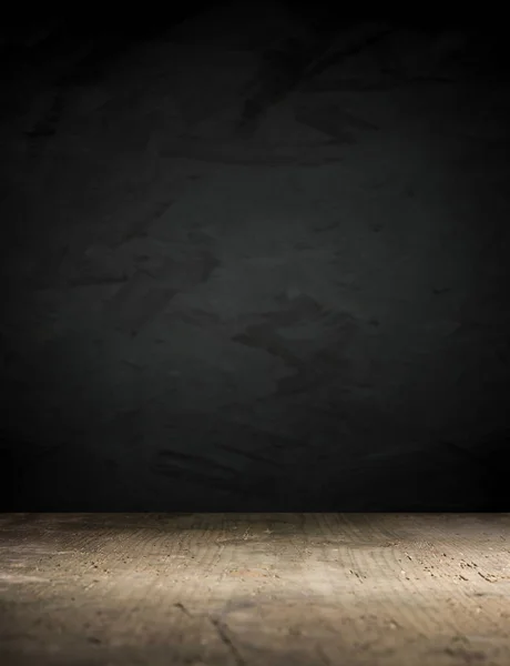 Old wood table top with smoke in the dark background.