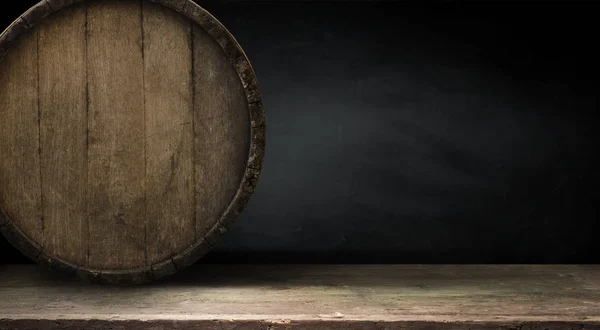 Old wood table top with smoke in the dark background.