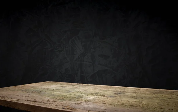 Old wood table with smoke in the dark background.