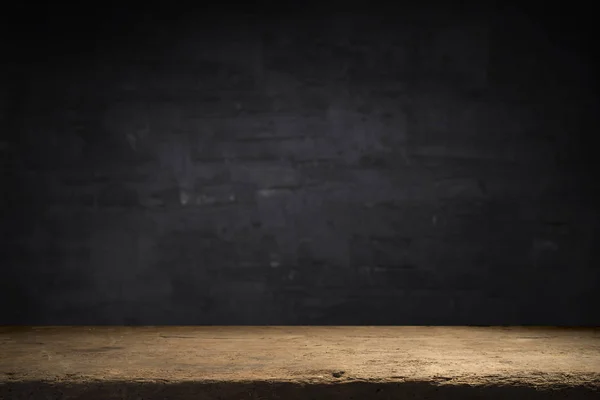 Old wood table with flame effect on dark background.