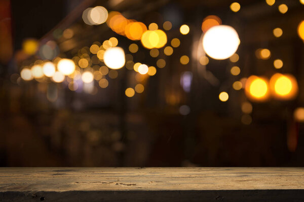 Beer barrel with beer glasses on a wooden table. The dark brown background.