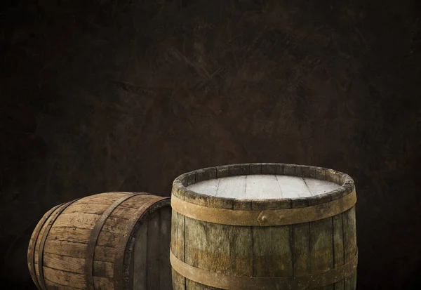 Oktoberfest beer barrel and beer glasses with wheat and hops on wooden table