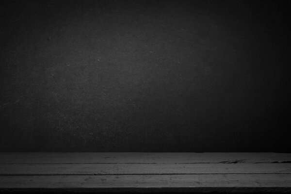 цементный пол в темной комнате с точечным освещением. черный фон
.