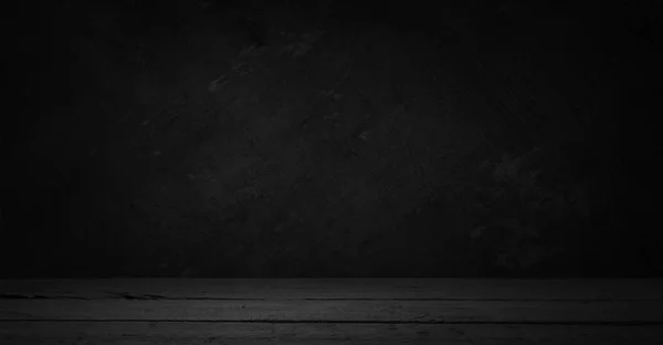 スポット ライトで暗い部屋でセメントの床。黒の背景. — ストック写真