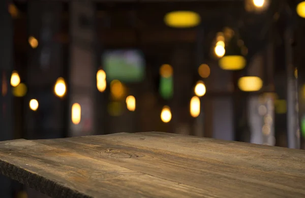 Blurred background of bar and dark brown desk space of retro wood — Stock Photo, Image