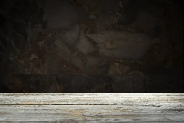 Old wooden table with brick background dark