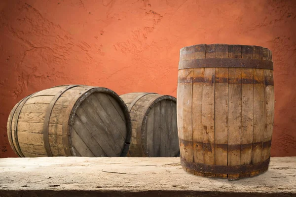 Wooden barrel on a table and textured background — Stock Photo, Image