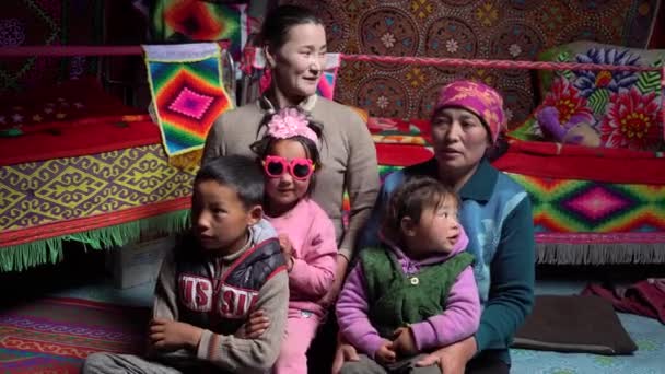 Mongolian family mother and children are photographed in a yurt — Stock Video