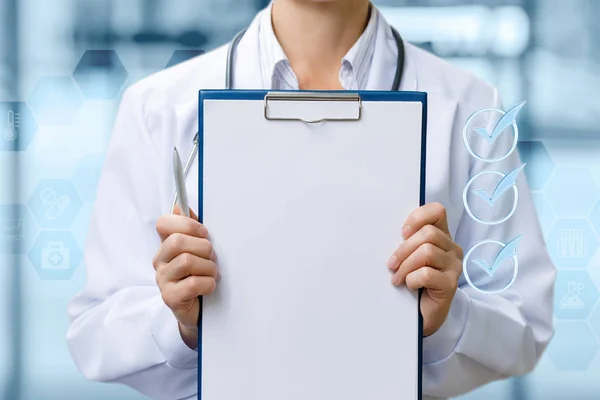 Doctor shows check list on blurred background.