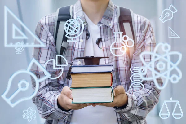 Student Shows Academic Cap Books Blurred Background — Stock Photo, Image